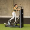 A Woman on a Glute Coaster Machine Side View