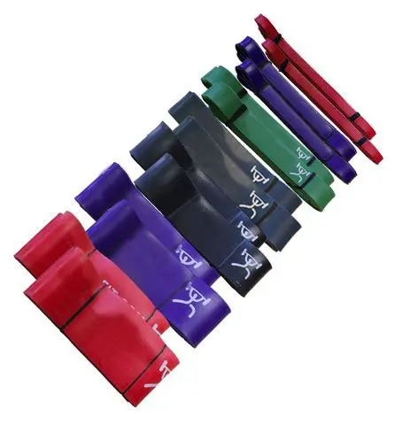 A set of different colored resistance bands on a white background.