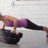 A Woman Exercising on a Smart Tera Core Balance Step